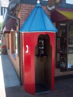 a pay phone cleverly disguised in pseudo-Danish garb