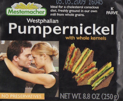 packaging for Mestemacher brand Westphalian Pumpernickel with whole kernels, showing a man and a woman two seconds away from passionate face-sucking